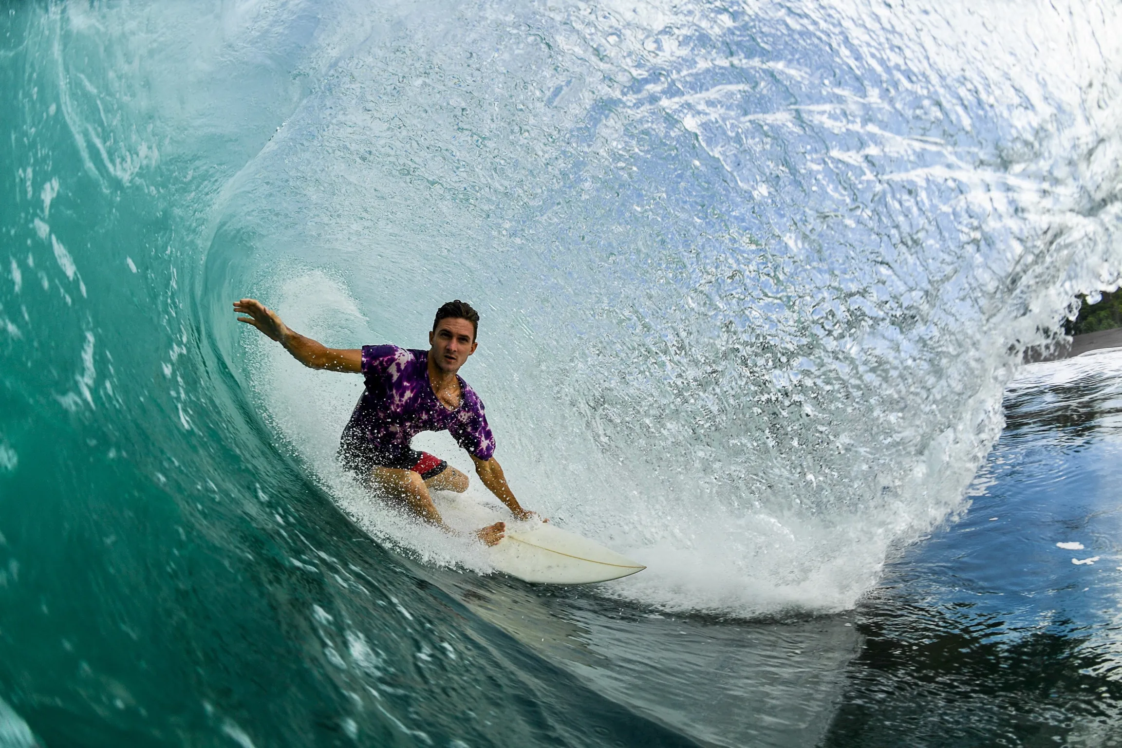 A surfer deep inside a barreling wave in Costa Rica
