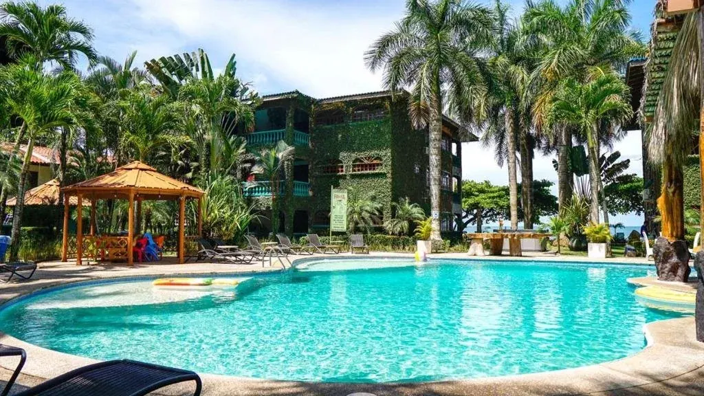 A large pool surrounded by palm trees